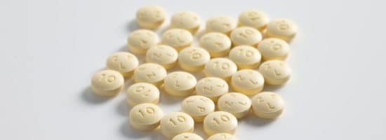 round yellow medication pill lot